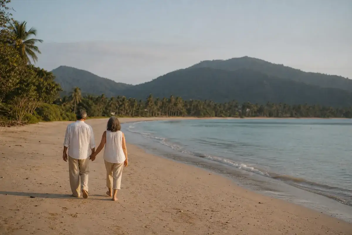  anonymous mature couple walking together on a quiet Palawan shoreline